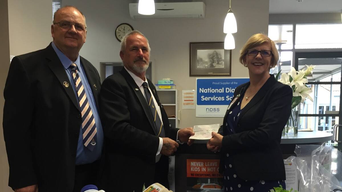 
Ray Jessup, Worshipful Master of the All Nations Lodge Clunes and Garry Elliot present the donation to Trish Collocott, CEO of Hepburn Health.