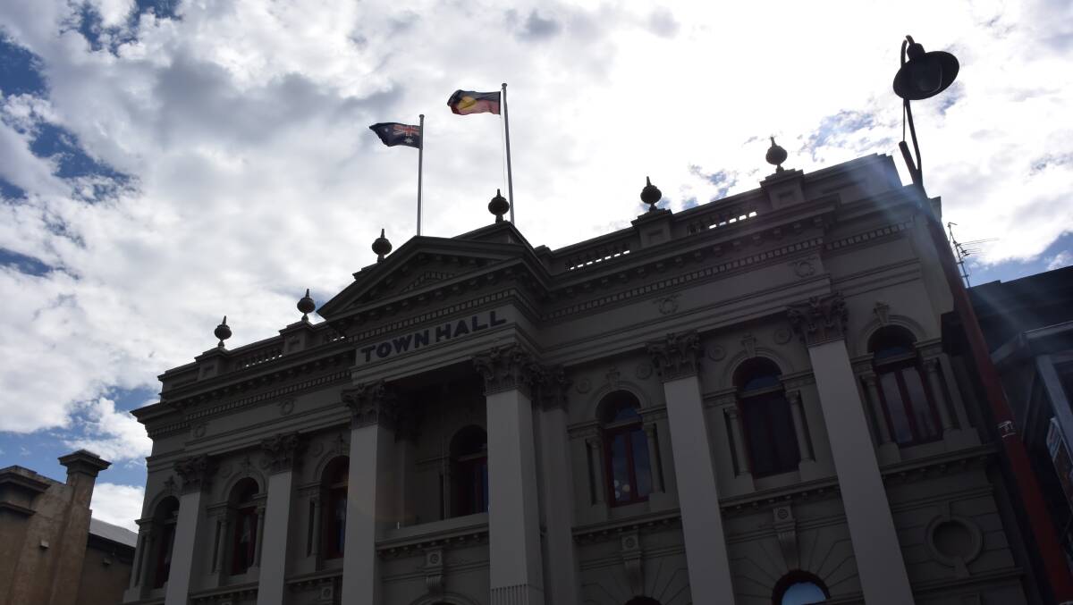Full mast: Daylesford Town Hall flags fly 24-hours and are lit at night; Creswick and Clunes town halls are now sans flags. Picture: Amber Wilson