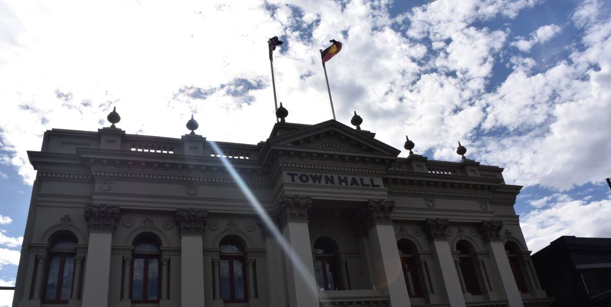 Full mast: The Daylesford Town Hall flags flying freely. Creswick and Clunes have had their town hall flags moved to other locations due to OHS concerns. Picture: Amber Wilson