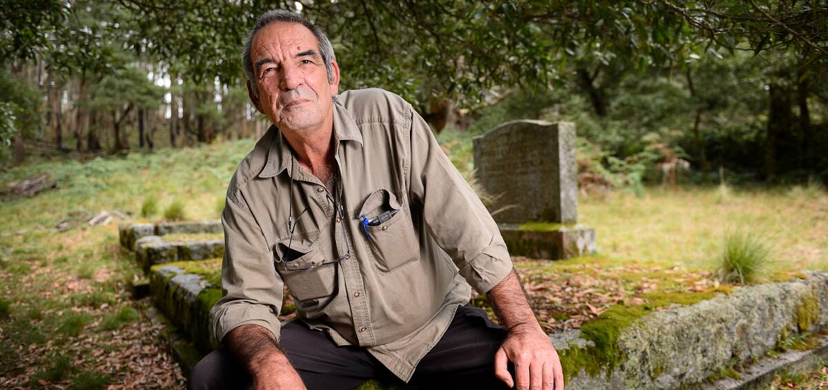 Show a bit of respect: Graham Walker is disgusted the Blue Mountain cemetery has been allowed to simply rot and be subsumed by bracken and growth. Picture: Dylan Burns