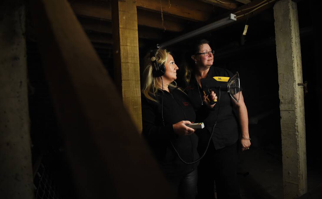 Bump in the night: Paranormal investigators Sam Gray and Deb Robinson at Blackwood Hotel. The pair believes the pub is haunted by the spirit of a young woman who died there accidentally in 1948. Picture: Luka Kauzlaric 