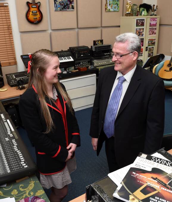 BUDDING MUSICIAN: Olivia Shalders of Ballarat Clarendon College will sing her original song, Right Here, at the Kool Skools awards night on December 18. She is pictured with Michael Koopman of Document Solutions Specialist. 