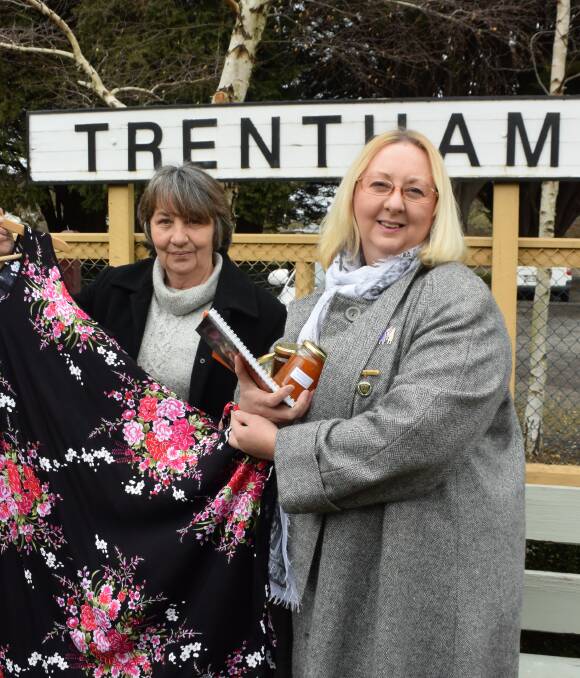 TREASURE EXPRESS: CWA member Leigh Cassidy and president Tracey Williams show off some of the great treasures available at the Trentham Railway Market. 