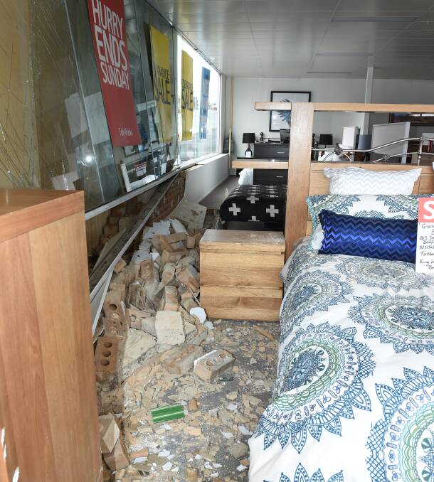 SMASHED: A car ploughed through the window of a Ballarat store just before midnight on Thursday. Picture: Lachlan Bence 
