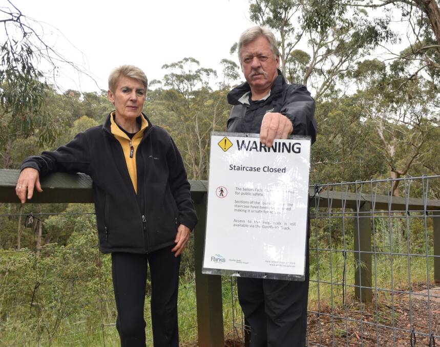 BLOCKED OUT: Margaret and Robert McDonald say the closure of the Sailors Falls walking track has impacted tourism and angered locals.