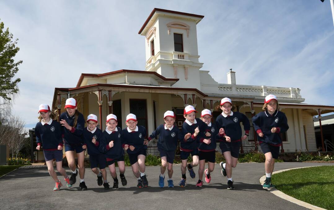 RUN READY: St Francis Xavier's cross country representatives take off to get training for Run Ballarat. Picture: Lachlan Bence