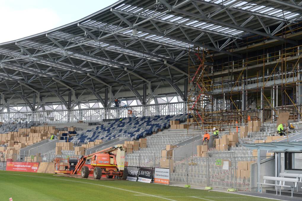 POTENTIAL: Seats unfold at Eureka Stadium this past week, but we need to think more about what kind of place we want this huge outdoor asset to be. Picture: Kate Healy