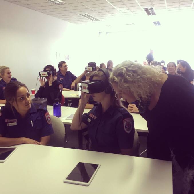 SCENARIO: Ambulance Services Minister Jill Hennessy watches as paramedics try the virtual reality training. Picture: @JillHennessyMP on Twitter