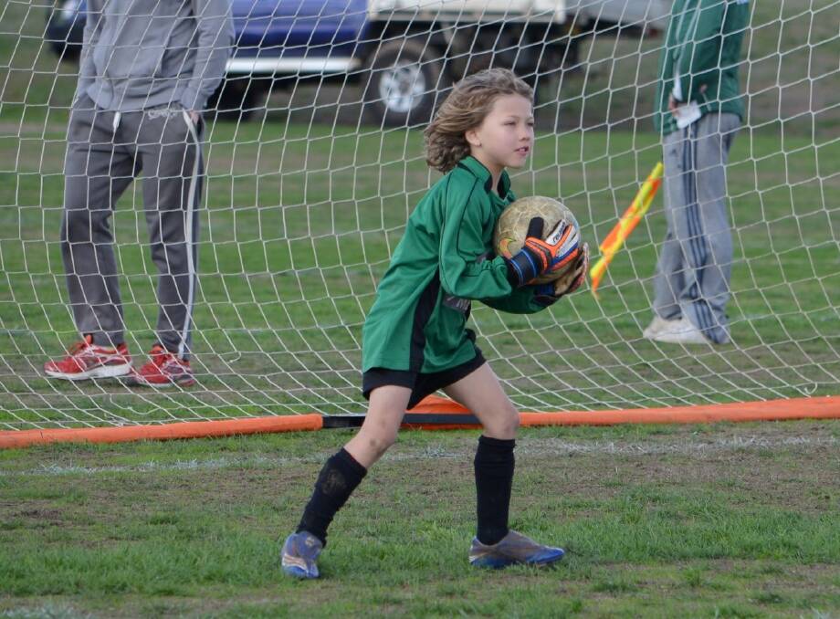 UNSTOPPABLE: Daylesford and Hepburn United Soccer Club goalie Frey Pelham saves another goal in the 6-2 win against Creswick on Sunday.