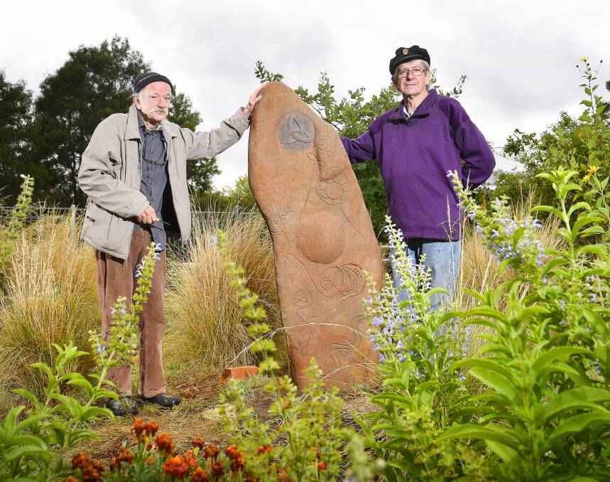 PROTEST: Sculptor Earl Ingleby and Hepburn Shire councillor Don Henderson with the standing stone in Creswick. Picture: Luka Kauzlaric
