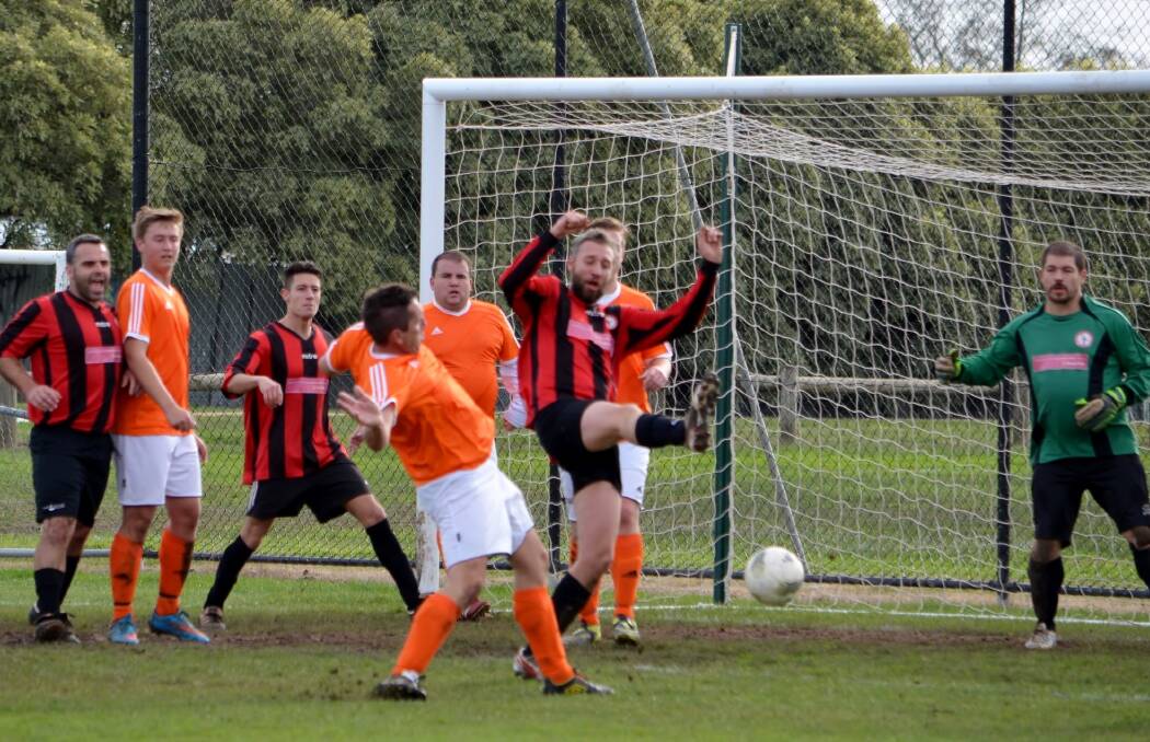IN ACTION: Tim Leney clearing in front of goals for Daylesford and Hepburn United during the senior match at the weekend. The United team beat the Sebastopol Vikings 7-1.