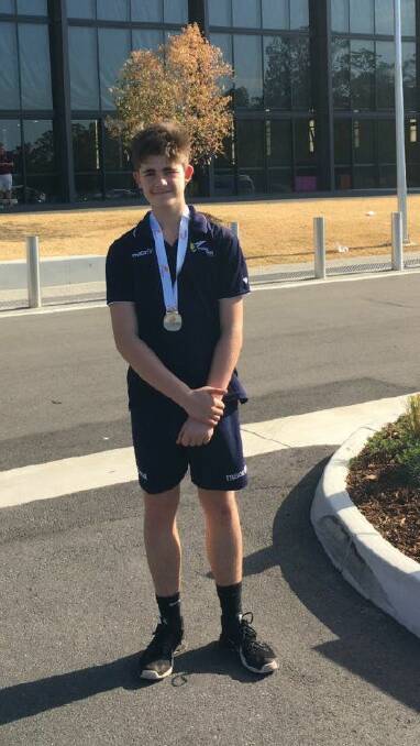 CHAMPION: Daylesford volleyballer Ben Tsaptsali proudly wears his silver medal which he won in Queensland during the recent school holidays.