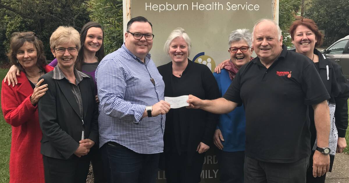 Giving: Farmers Arms Hotel's Mitch Duncan (left) hands a cheque to Danny Moynihan from the Daylesford Xmas Cheer committee.  Picture: Supplied. 