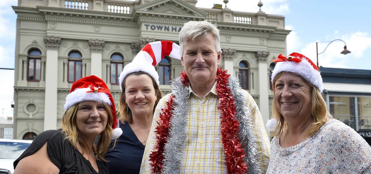Teaming up: Rae Pfeiffer, Rebecca Pedretti, Nigel Fitzpatrick and Sue Waters prepare for Christmas in Daylesford.  Picture: Dylan Burns. 