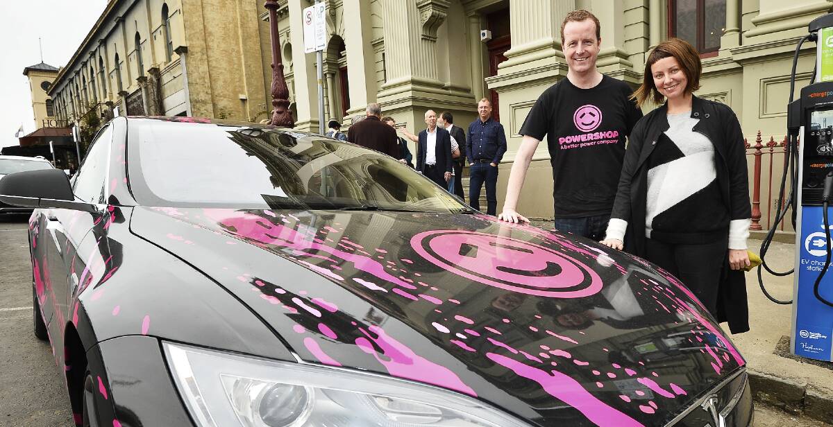 Charging: Powershop CEO Ed McManus and Hepburn Wind community manager Taryn Lane next to an electric vehicle at the Daylesford Town Hall.  Picture: Dylan Burns. 
