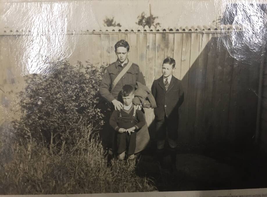 Before the storm: Tom in uniform with his brothers Denis and Mick in 1941. Picture: Paul Murphy.