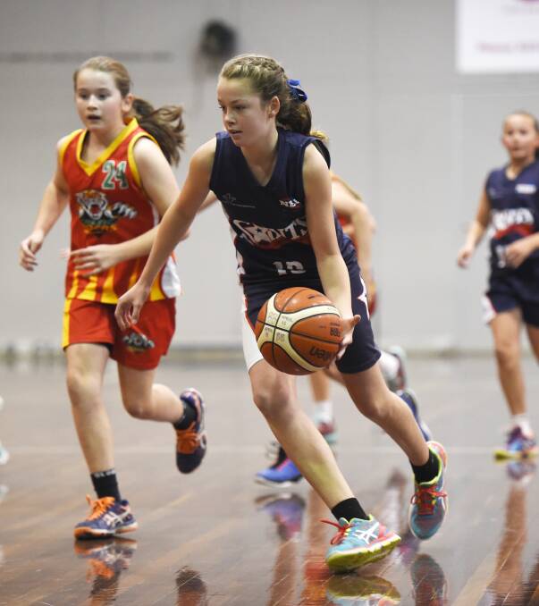 Saints Liberty under-12 basketballer Milly Sharp takes on Celtic Tigers this year. Both clubs will have a team registered for this weekend's Basketball Championships.