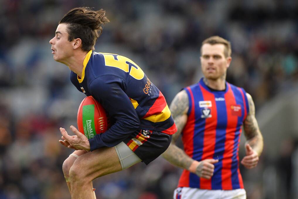 MARK: Beaufort winger Zac Marrow takes a grab as Hepburn rival Luke Stanton looks on. Marrow was a solid contributor for the Crows on Saturday.