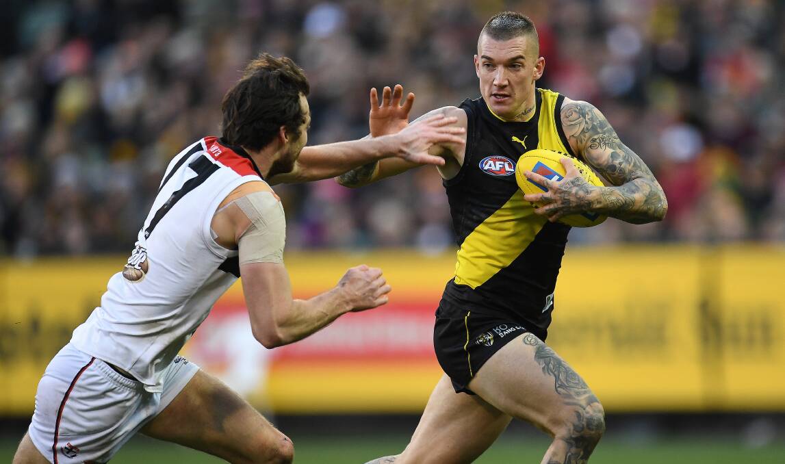 STAR: Tiger Dustin Martin, making his trademark don't argue move, has given rampant Richmond supporters more to roar about, adding an extra edge leading into AFL finals.Picture: AAP