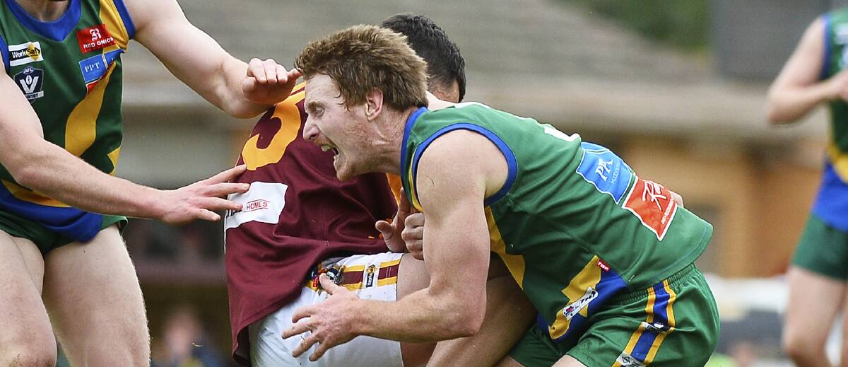CRUNCH: Lake Wendouree midfielder Nick Peters and Redan forward Grant Bell collide at pace. Picture: Dylan Burns
