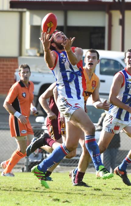SETBACK: Rylan Rattley takes an uncontested mark before being forced from the ground with a fracture ankle. Picture: Lachlan Bence