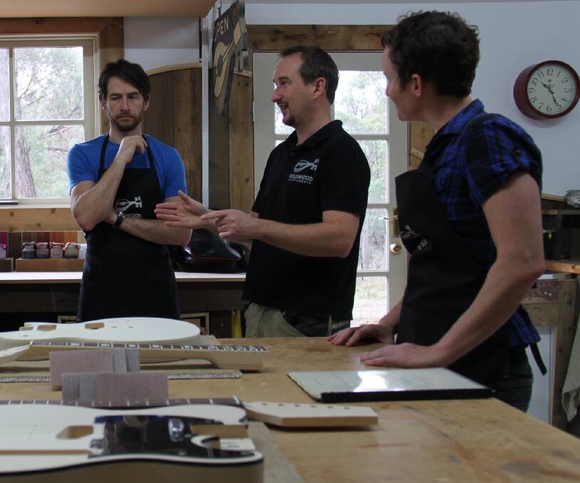 Precision: Luthier Nick Carpenter (middle) has introduced a two-day electric guitar making course. Picture: contributed