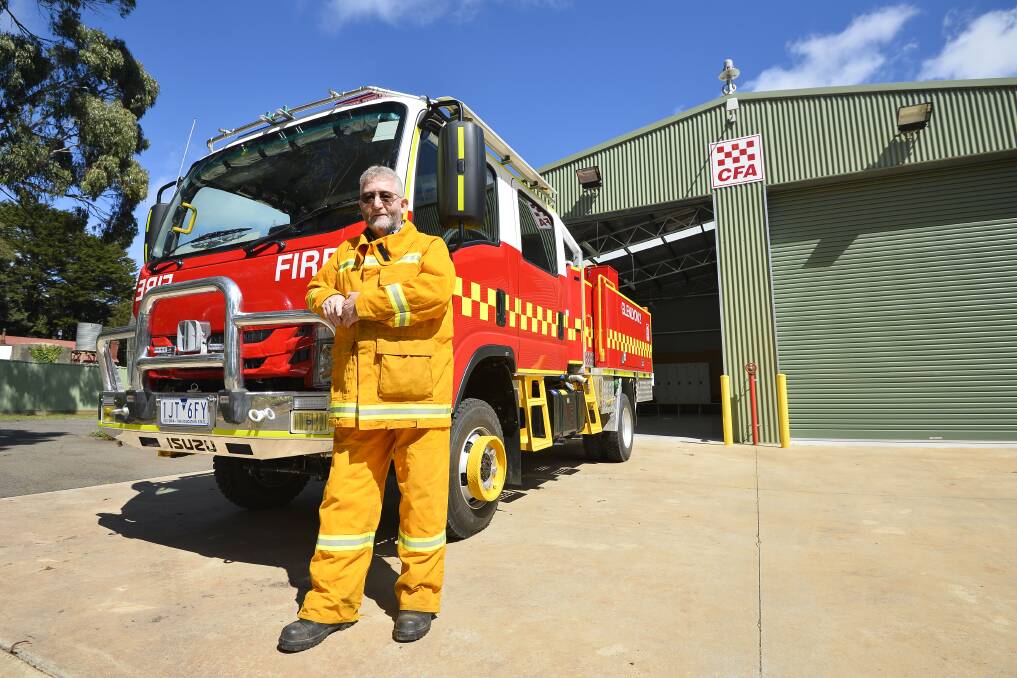 STATE-OF-THE-ART: Glenlyon Fire Brigade volunteer Trevor Chester stands in front of the new tanker that can hold more water, equipment and crew. Picture: Dylan Burns.