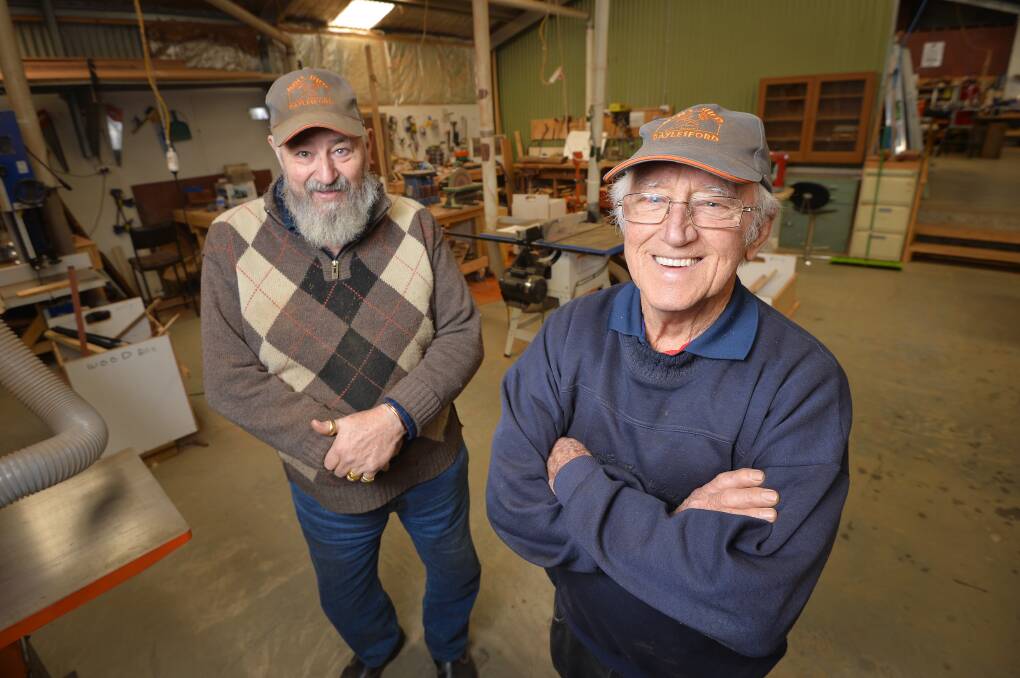 VOLUNTEER SUPPORT: Daylesford Men's Shed members John Wolfs and Ken Ferguson love working in their shed and helping the community. Picture: Dylan Burns