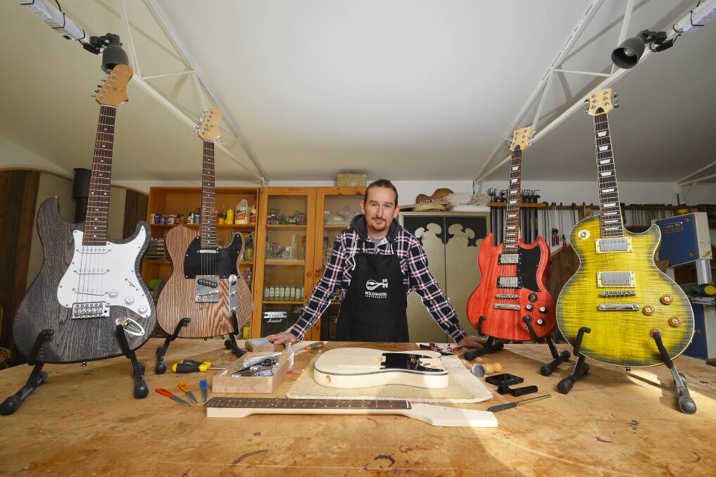 CREATE: Guitar maker Nick Carpenter makes instruments in his workshop in a green Mount Franklin setting. Picture: Dylan Burns. 