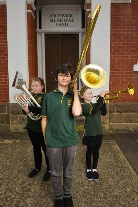 BRASS: Ada Drylie, 10, Alexander Clark, 9, and Sorrel Drylie, 9, are members of the Creswick Youth Brass Band who will be competing at the South Street Eisteddfod for the state youth band championship. Picture: Dylan Burns.
