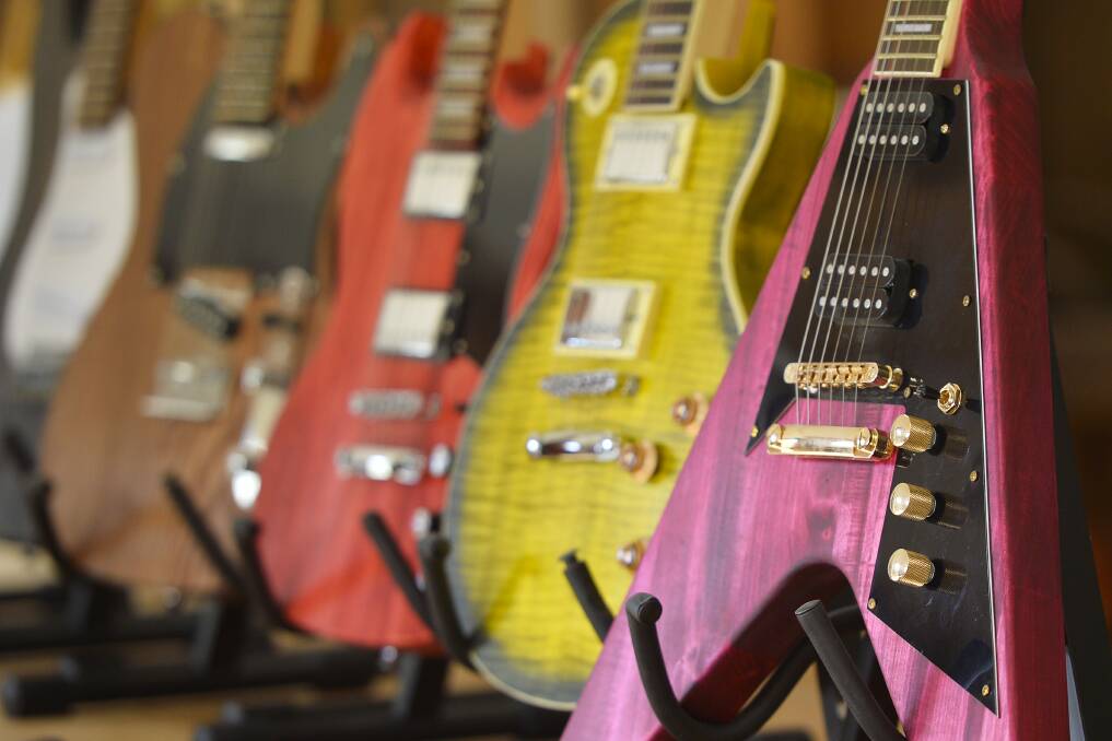 STYLE: Participants choose from a variety of colours and styles to make their own guitar. Picture: Dylan Burns. 