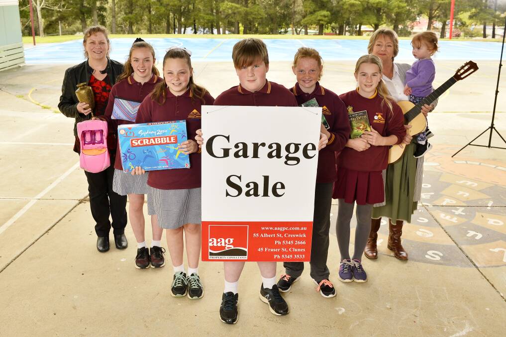 GARAGE SALE: Creswick North Primary School students prepare for a car boot sale as part of the Creswick Community Garage Sale on Saturday. Picture: Dylan Burns. 