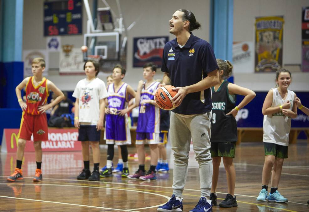 STAR OF THE SHOW: Olympian and Australian Boomer Chris Goulding delighted Ballarat's junior basketball players at Saturday's skills and drills clinic at the Mars Minerdome. Picture: Luka Kauzlaric 