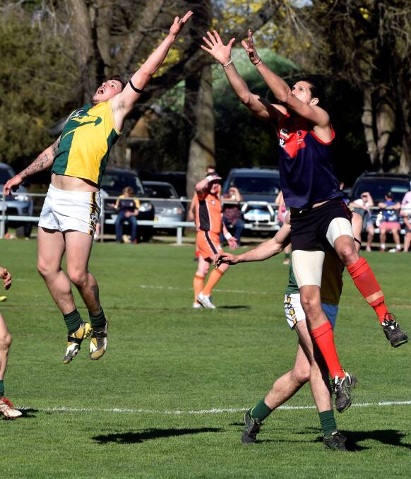 AERIAL BATTLE: Gordon’s Harley Hunter competes with Bungaree’s David Benson. Picture: JEREMY BANNISTER