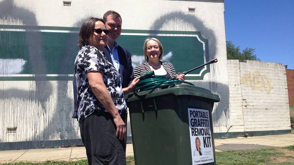 Creswick Neighbourhood Centre chair Jenni Sewell with opposition spokesperson for community safety Edward O'Donohue and member for Ripon Louise Staley ready to clean the graffiti from the British Hotel.