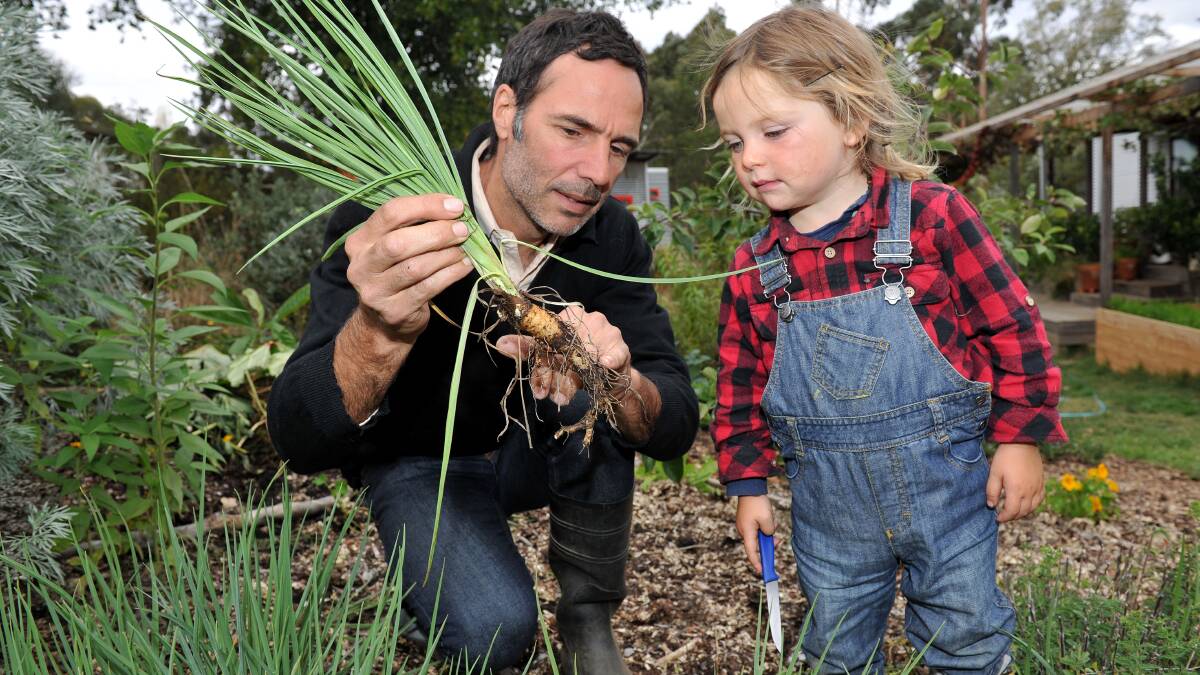 Patrick Jones is pictured with his son Woody Ulman Jones digging a selection of these from his abundant garden. Picture: JULIE HOUGH