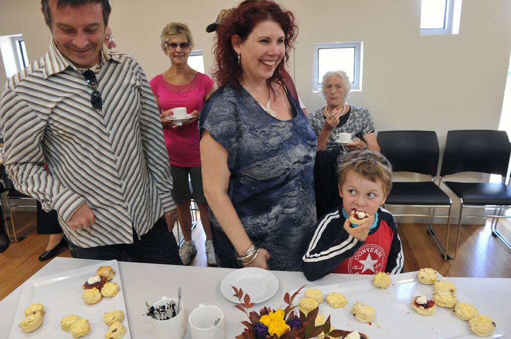 Tarquin Percy-Williams enjoying a scone at the morning tea with mum Kim Percy and dad Morgan Williams.

Picture: JULIE HOUGH
