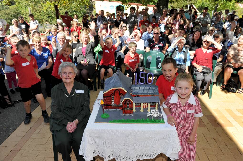 
Former pupil and oldest attending on the day Beryl Mitchell (nee Olver) and prep 
pupils Luca MacDonald (at back) and Luca (correct) Chapman with the special anniversary cake.

Picture: JULIE HOUGH 