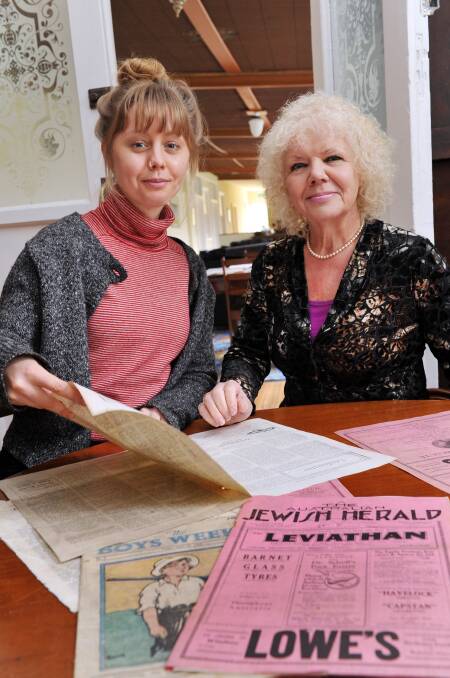 DISCOVERY: Pictured browsing  newspapers found at the Continental Guest House are Sarah Leeworthy (yoga activities co-ordinator) and owner Veronica Whitter. Picture: JULIE HOUGH
