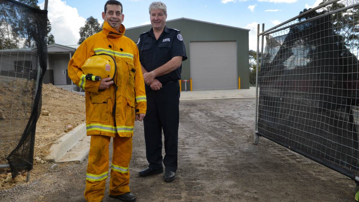 READY TO GO: Volunteer firefighter Tony Raftes and Archie Conroy, CFA District 15 Duty officer at the site of the new Hepburn Springs fire station. Picture:  BRENDAN McCARTHY