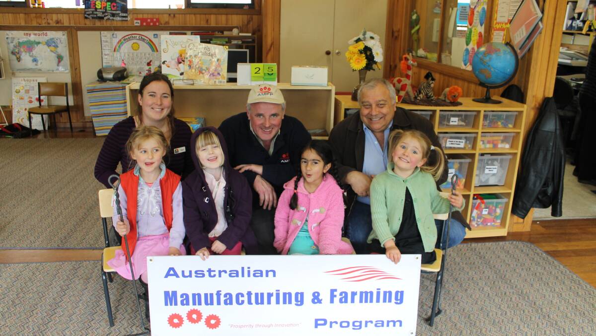 SEAT OF LEARNING: Enjoying some of 28 Australian-made wooden chairs donated to the Hepburn kindergarten by the  Democratic Labor Party are (from left) Matilda, Sari, Gurnoor and Jaimie. Looking on  are kindergarten assistant Tegan Nixon, Senator John Madigan and Cr Pierre Niclas. 