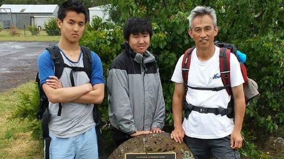 HARD YARDS: Charles Zhang, son Oscar, and  Jack Mao who joined Charles and Oscar for part of the walk.