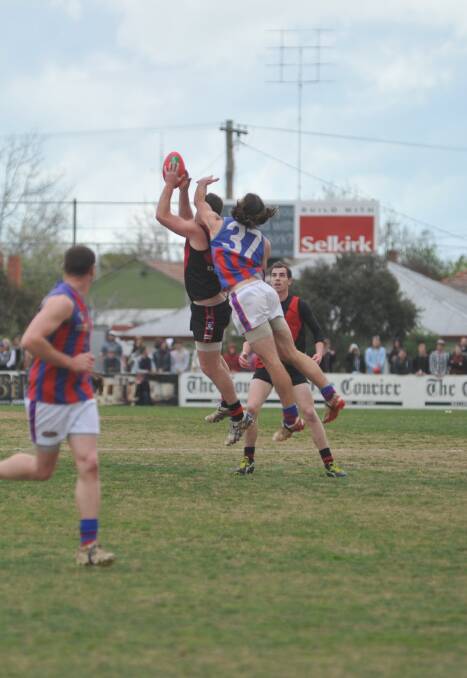 The Bill Malone medallist for best-on-ground, Daniel Smith, goes for a mark.