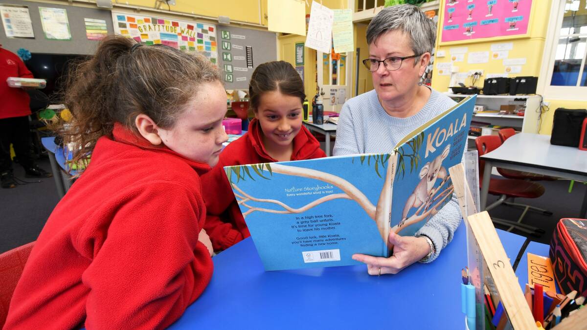 WISE WORDS: Picture book author, Claire Saxby, shares the story behind her book 'Koala' with Sophie,9, and Ruby,9, at Skipton Primary School. Picture: Lachlan Bence