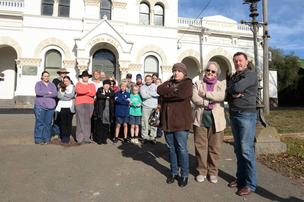 Fed up:Jackie Rozenfeld, Cheryl Clapton and Steve Crane with dozens of Clunes residents who are calling for a cull of feral cats throughout the town.  Picture: Kate Healy.  