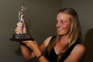 Zoe Hives holds her Ballaray 2012 Sportsgirl of the Year trophy high after winning the award. Picture: Justin Whitelock