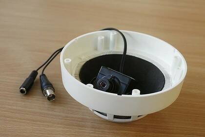 A camera hidden in a fake smoke detector.