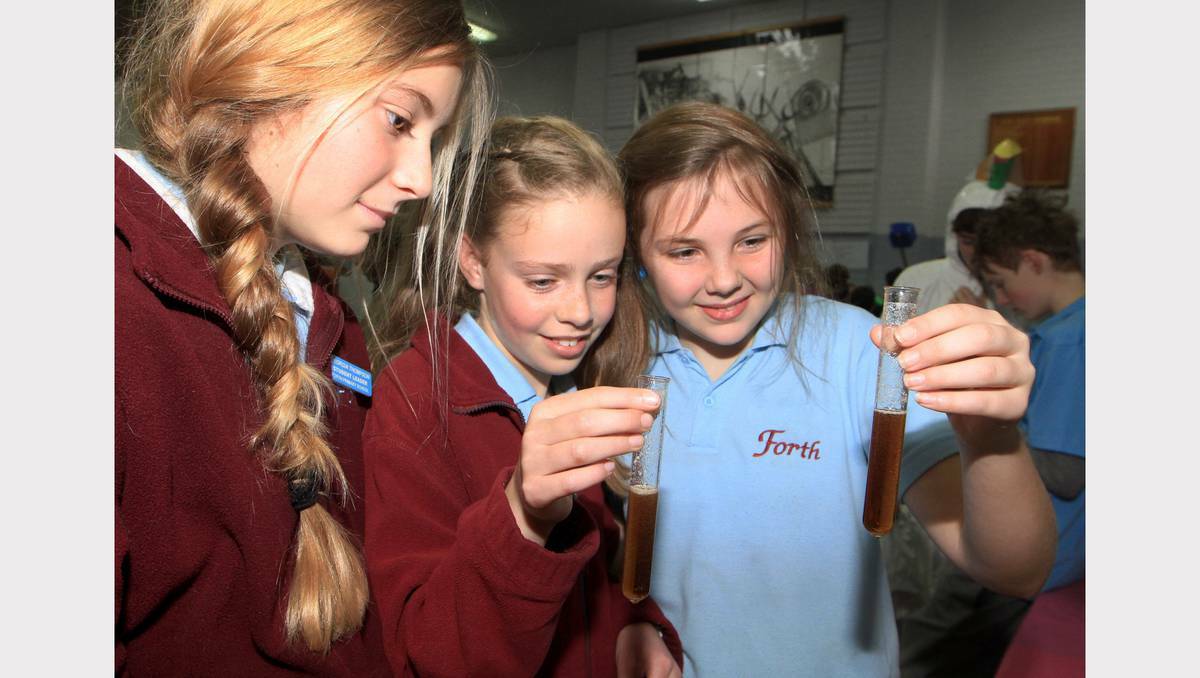 TASMANIA: Forth Primary School pupils (from left) Georgia Thompson, Oaklee Young and Lili Spuire check out the chemical reaction at the 'displacement of a diet coke bomb' display. Picture: Meg Windram.