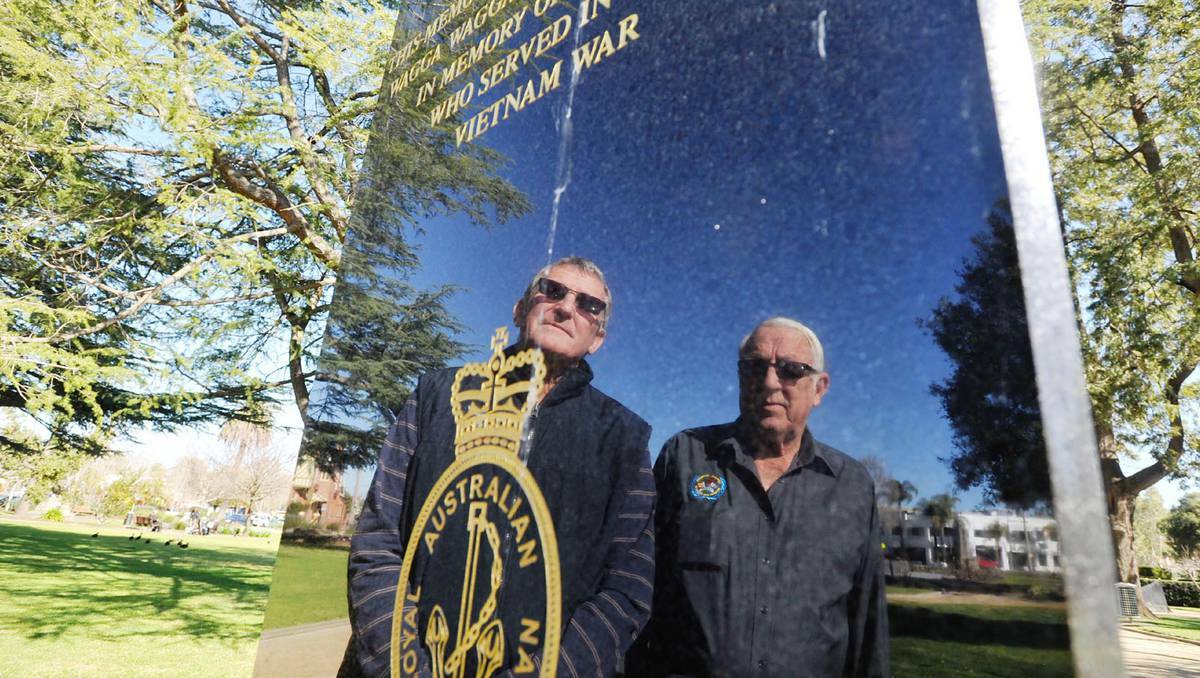 WAGGA WAGGA: Wagga Vietnam War veterans Ralph Todd and Neville Smerdon look at the Vietnam veterans memorial in the Victory Memorial Gardens. Picture: Alastair Brook