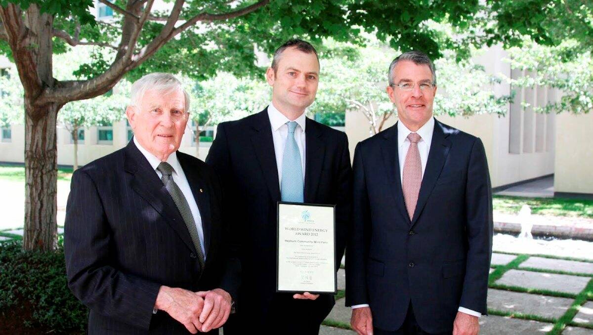 Recognition: Founding chair of Hepburn Wind Peter Rae AO, left, Simon Holmes à Court and Mark Dreyfus MP at Parliament House in Canberra to recognise the achievement of Hepburn Wind in receiving the World Wind Energy Award. 